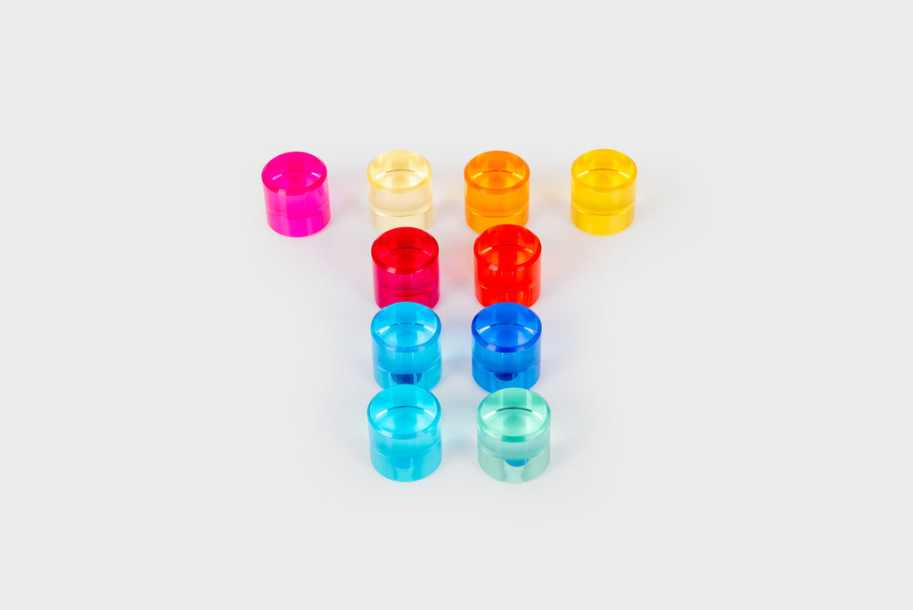 Set of small clear gem cylinders in assorted colors, including pink, blue, and red.