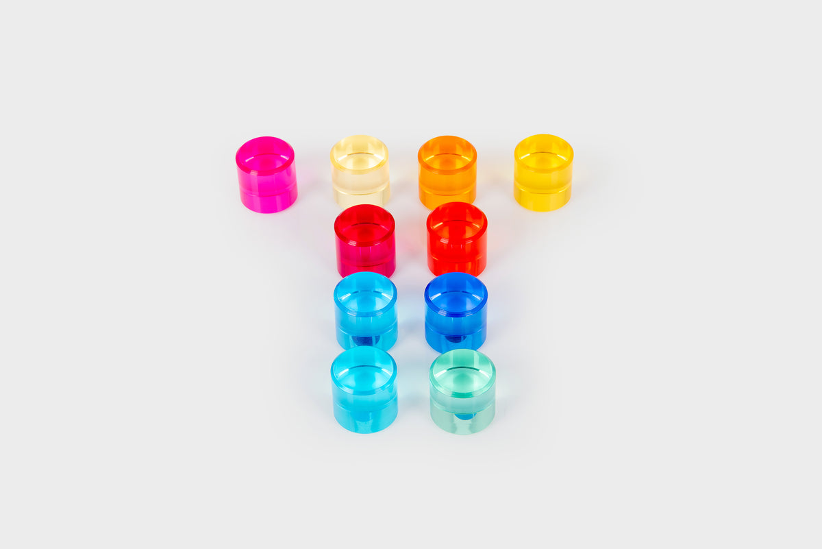 Set of small clear gem cylinders in assorted colors, including pink, blue, and red.
