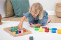 Colorful translucent gem cube blocks in a wooden tray for stacking and sorting