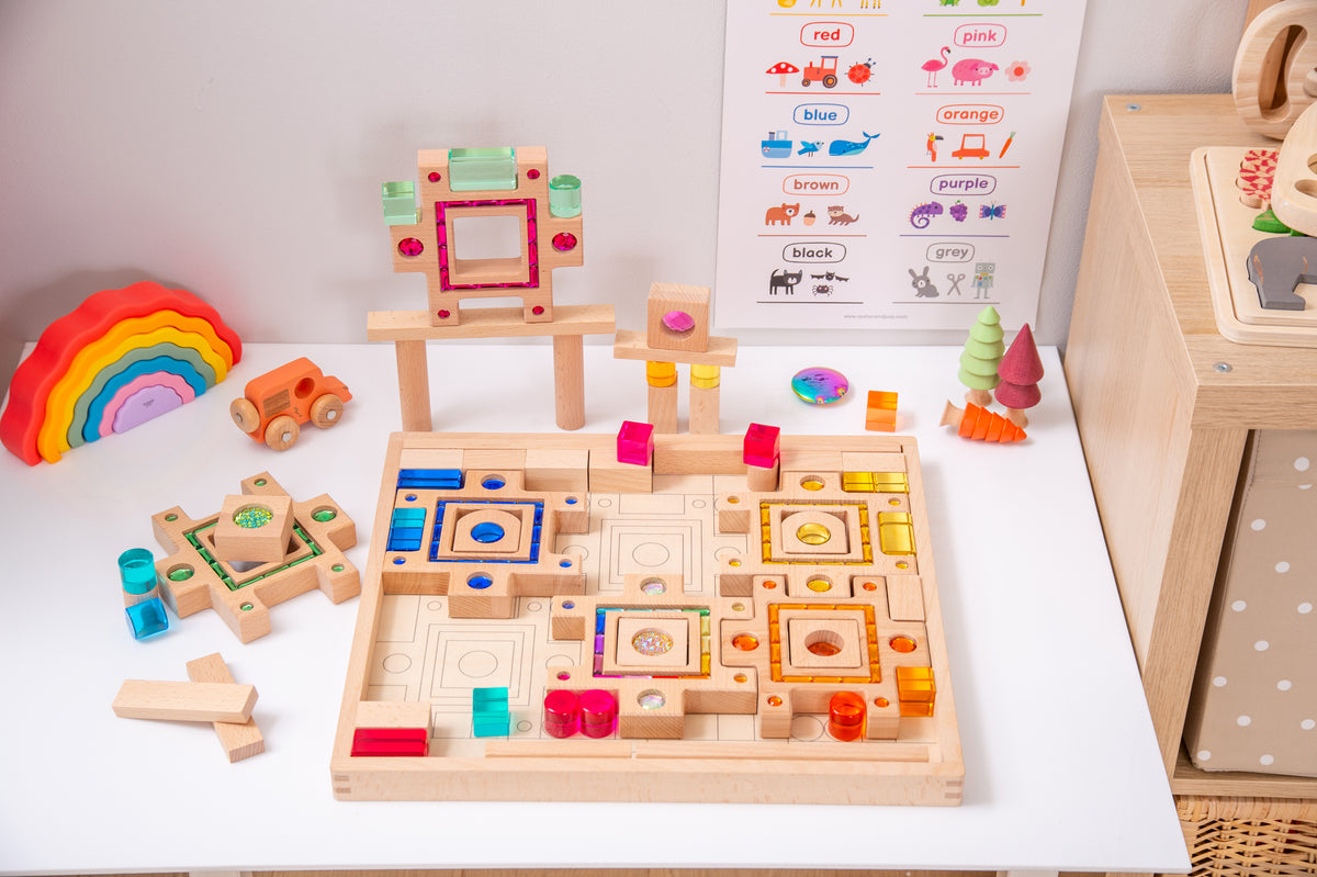 Wooden gem puzzle set with board, block tiles, and small geometric pieces