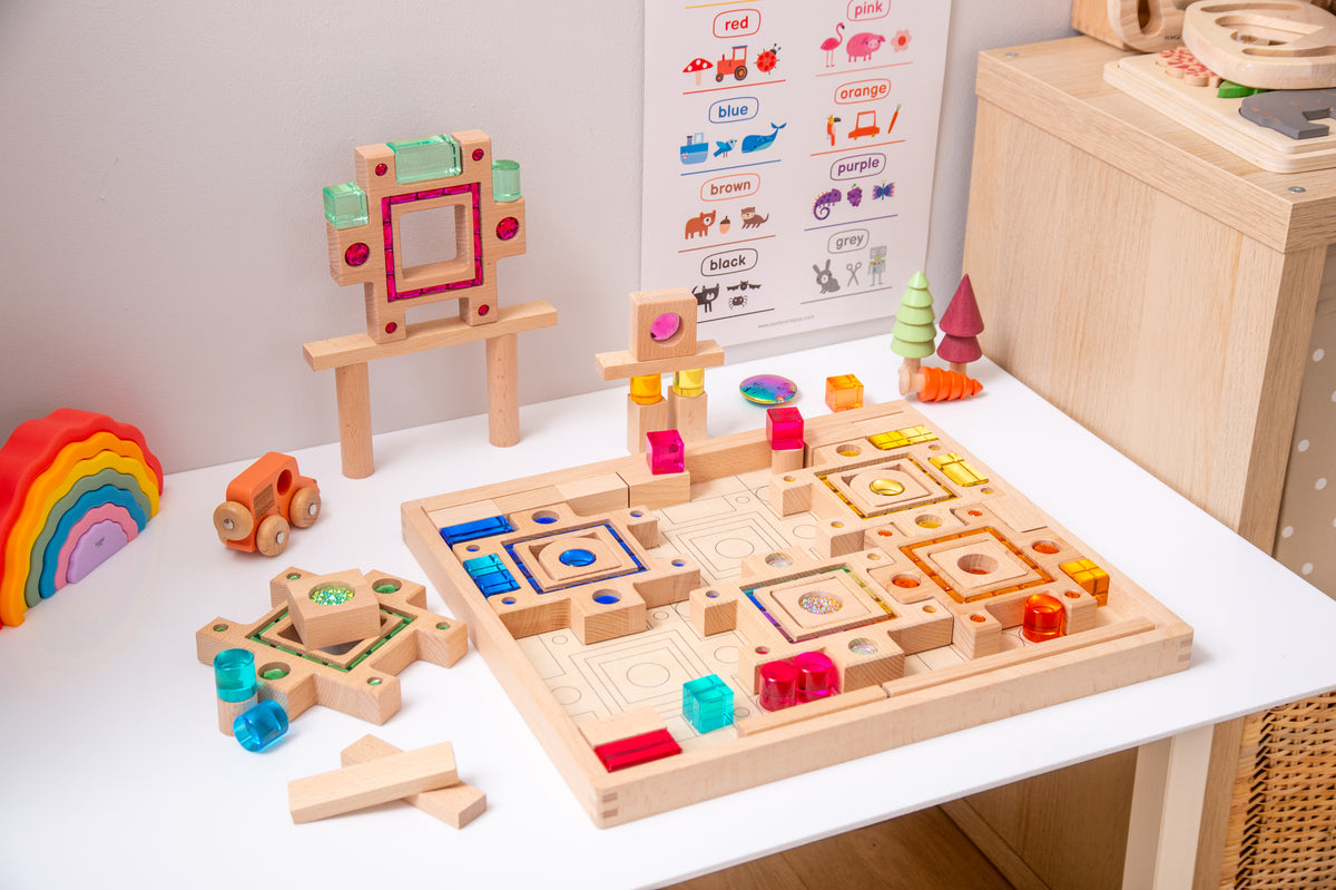 Wooden gem puzzle set with board, rainbow stack, and colorful geometric block pieces