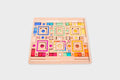 Wooden gem puzzle board with multicolor square, circle, and gem tiles