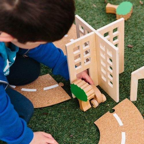 Wooden town play set gate with slatted doors and small track pieces for kids