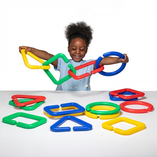Giant linking shapes set with colorful foam interlocking pieces, held by a child
