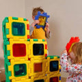 Colorful interlocking window blocks with square colored panels and cutout openings