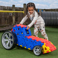 Colorful polydron vehicle toy with blue and red panels and gray wheels