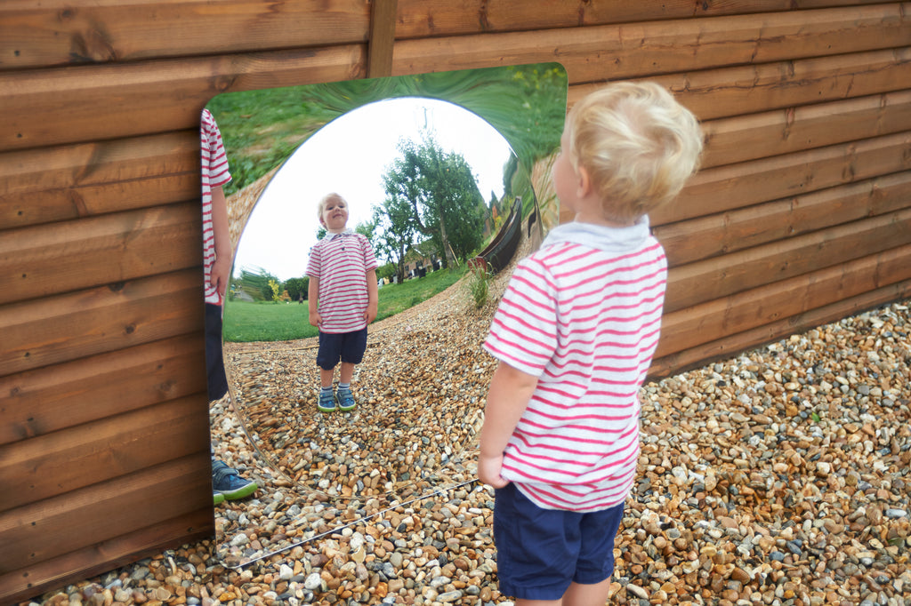 Acrylic dome mirror panel in wooden garden wall with rounded reflective opening