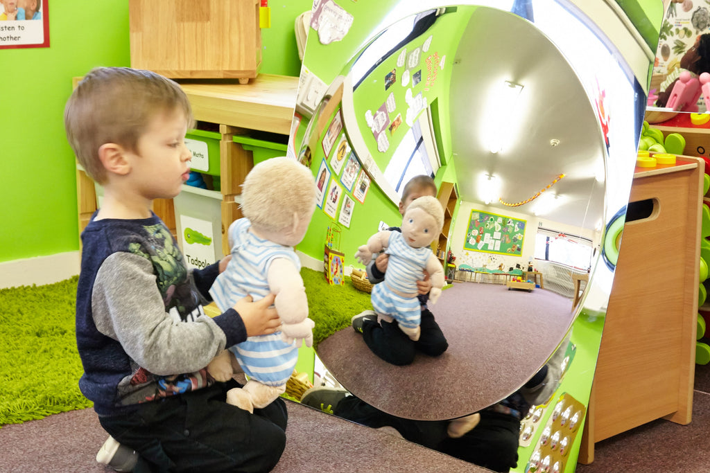 Large single acrylic mirror dome panel with rounded reflective surface for playrooms