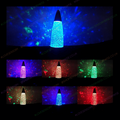 Glitter color-change lamp with cone shade glowing in blue and multicolor specks