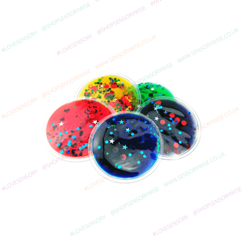 Sensory glitter disc with domed clear top, dark blue center with red and teal stars