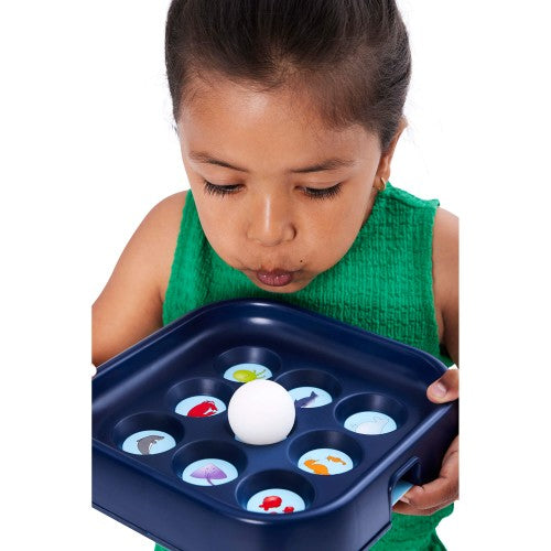 Gonge Blow Lotto game board with colorful discs and white ball held by child