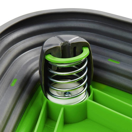Close-up of green top on dark gray spring balance rocker