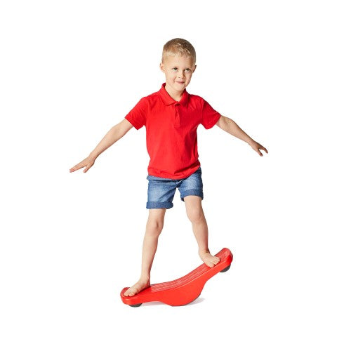 Red rocker-style balance board with curved surface for standing and stepping