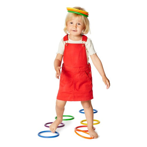 Balance stepping hoops for standing, with stacked green and rainbow-colored rings