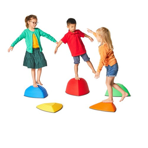 Colorful balance domes and stepping pads for group motor-skill play