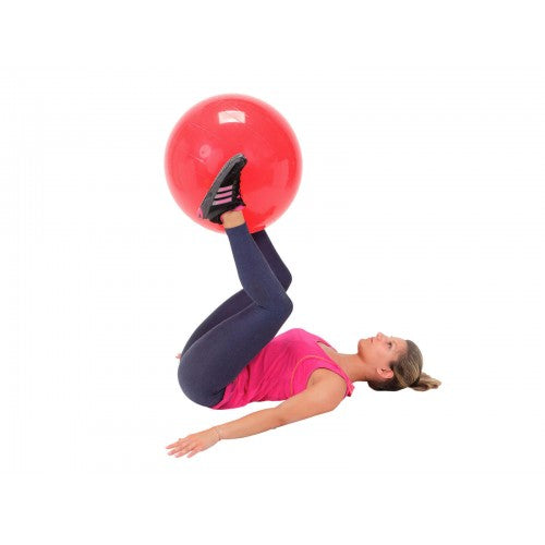 Red round physio therapy ball with person lying back in stretch position