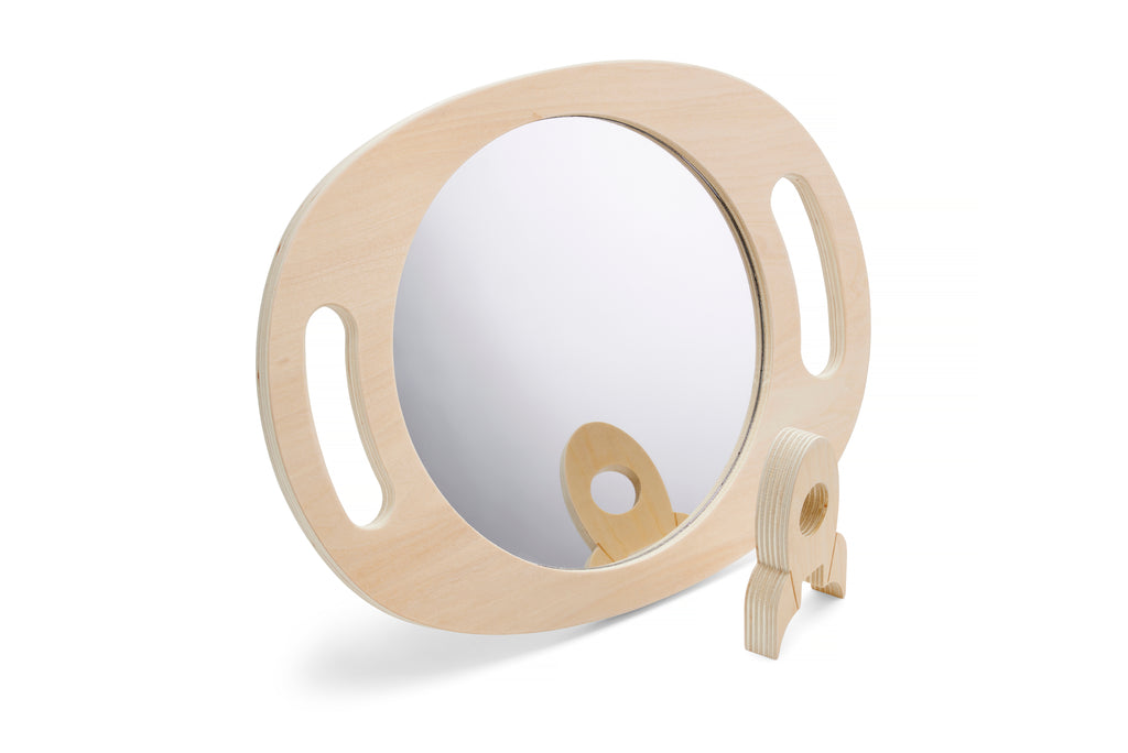 Light wood handheld round mirror with oval reflective glass and side handle cutouts