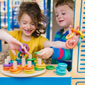 Colorful rainbow hoop stacking toy with rings and pegs