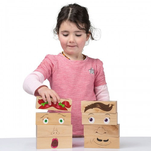 Wooden emotion blocks with colorful face graphics, stacked into four cube blocks
