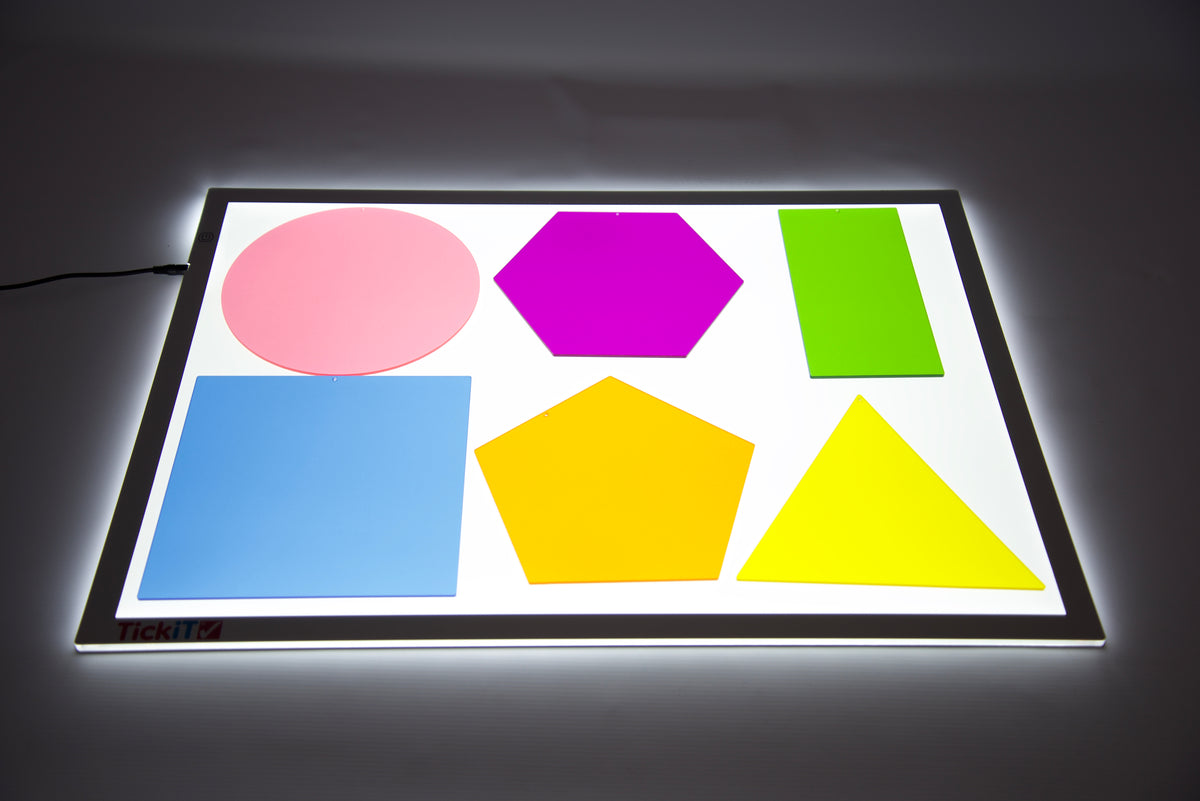 Lightbox tray with large colorful shapes: circle, hexagon, square, triangle