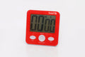 Red digital timer device with large display and TickiT logo on front panel