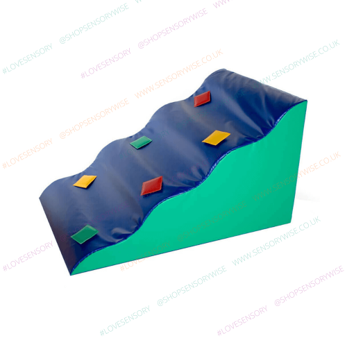Blue and green foam play wedge with colorful corner tabs, wave-style half block