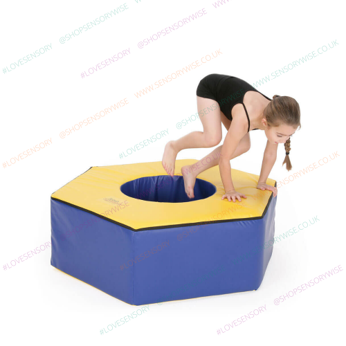 Foam play cube, blue with yellow top and circular opening for kids’ climbing
