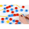 Colorful alphabet letter beads for lacing, with hand threading a bead