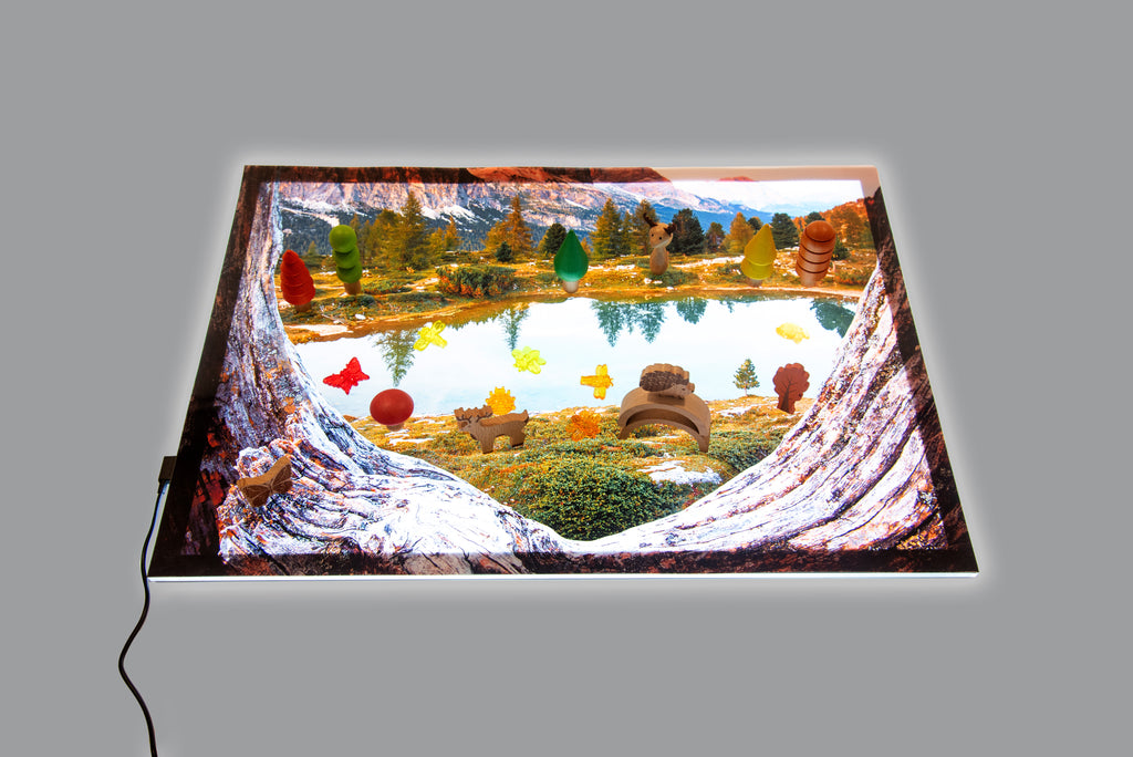 Kids’ play mat with lake landscape, trees, and curved opening design
