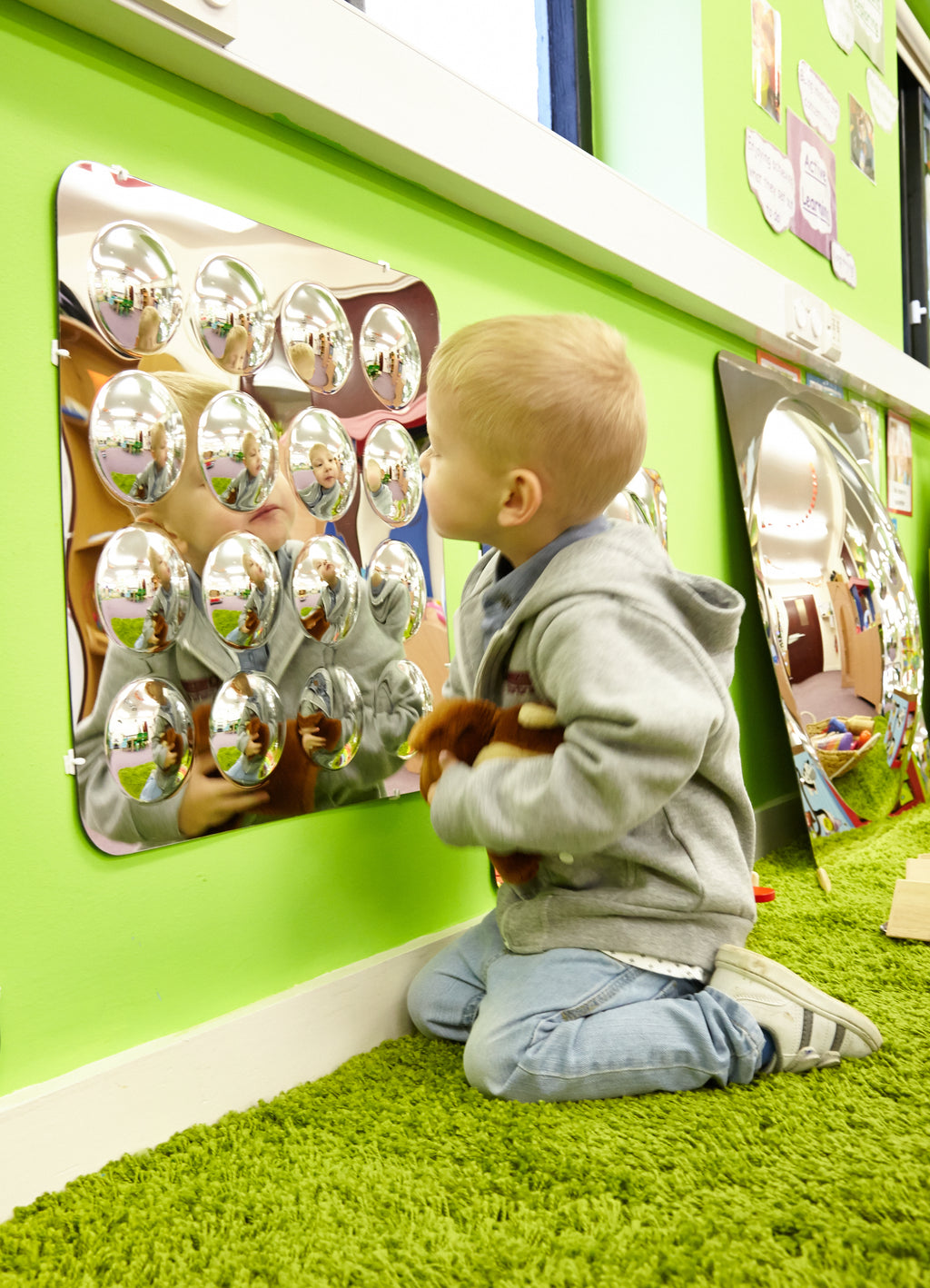 Large acrylic mirror panel with 16 domed round mirrors, wall-mounted