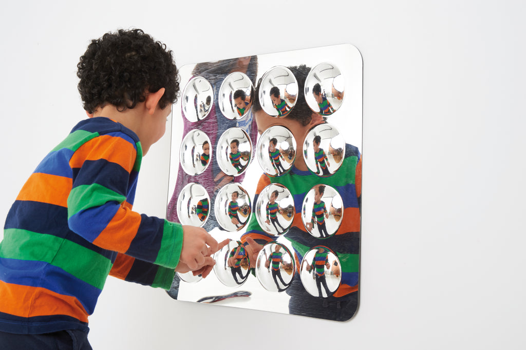Large acrylic mirror panel with 16 domed round mirrors, front view at angle