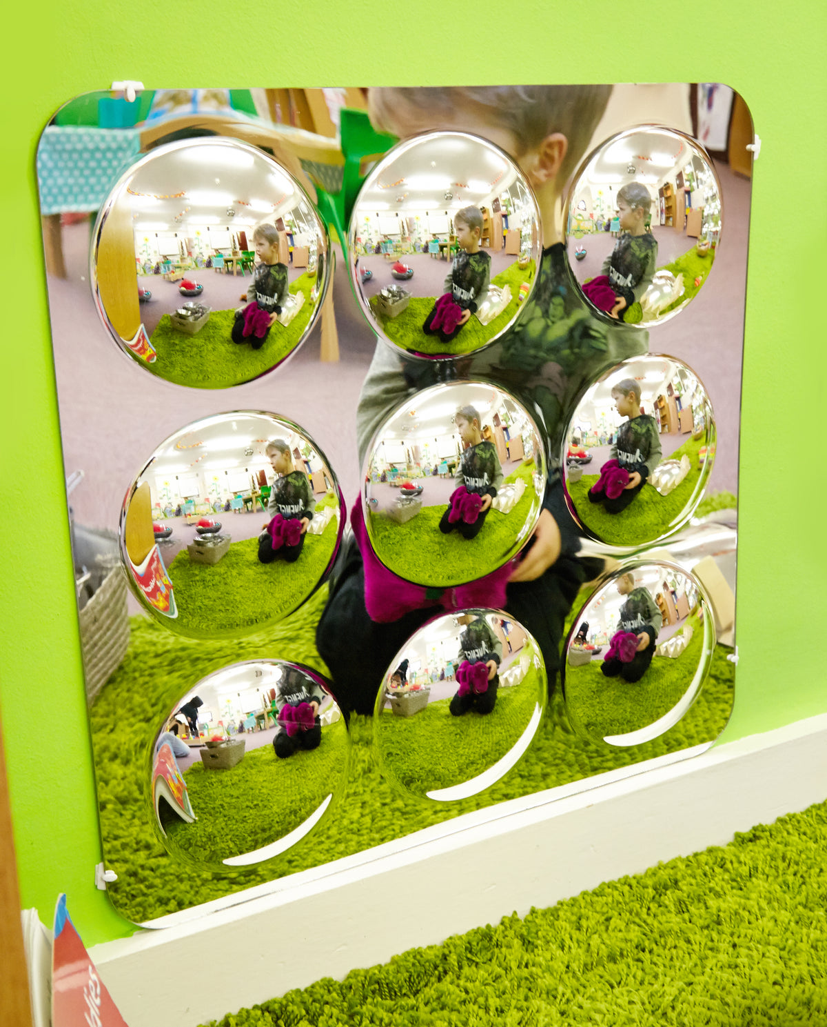 Large acrylic mirror panel with nine domed round mirrors featuring multiple reflections