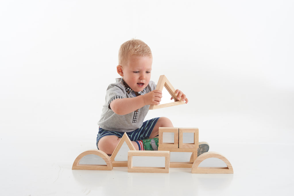 Wooden mirror blocks with arched supports and window inserts, assembled on play set