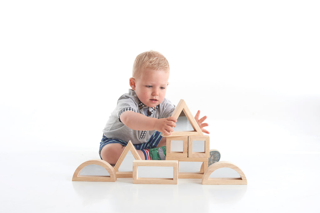 Wooden mirror blocks set with arched side panels and stacked window frames