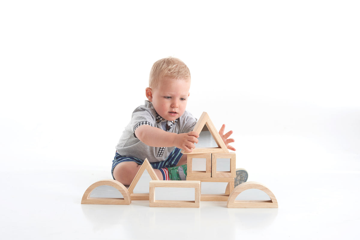 Wooden mirror blocks set with arched side panels and stacked window frames