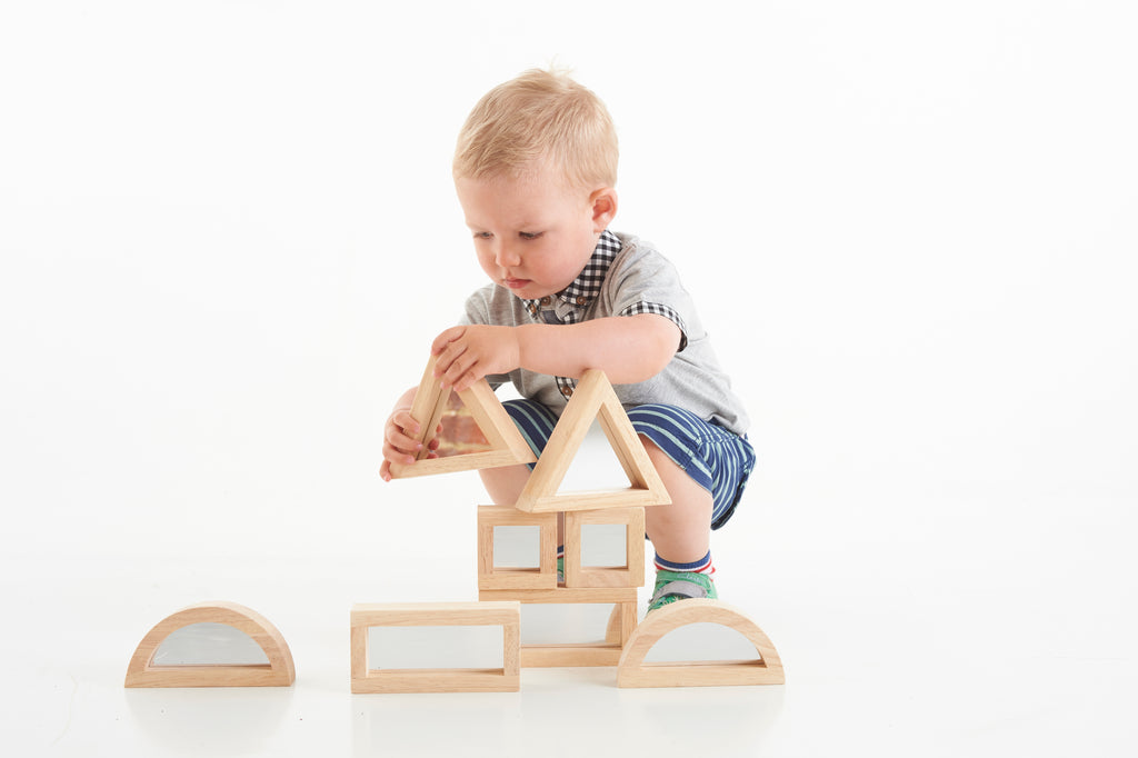 Wooden mirror blocks with triangular frame and square window, partially assembled