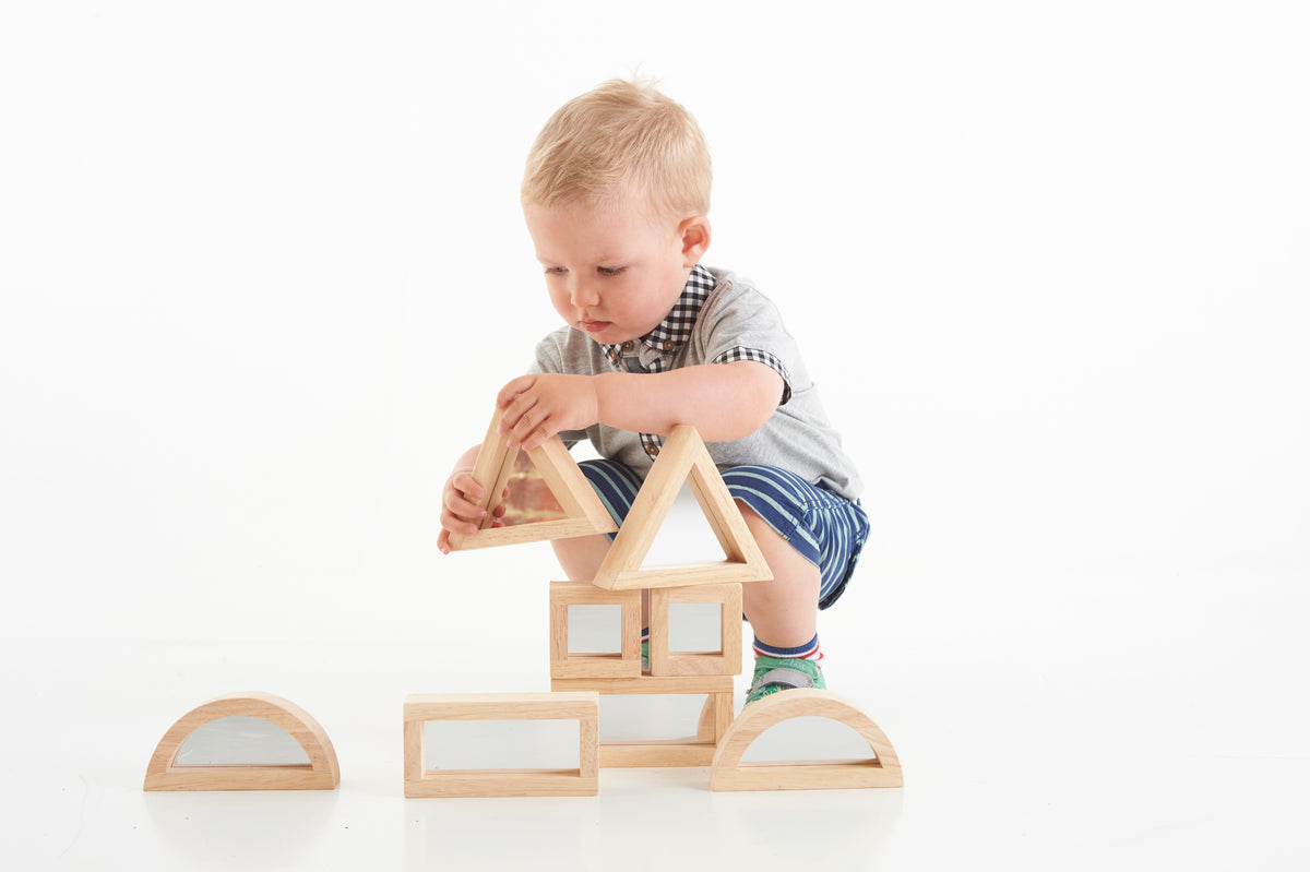Wooden mirror blocks with triangular frame and square window, partially assembled