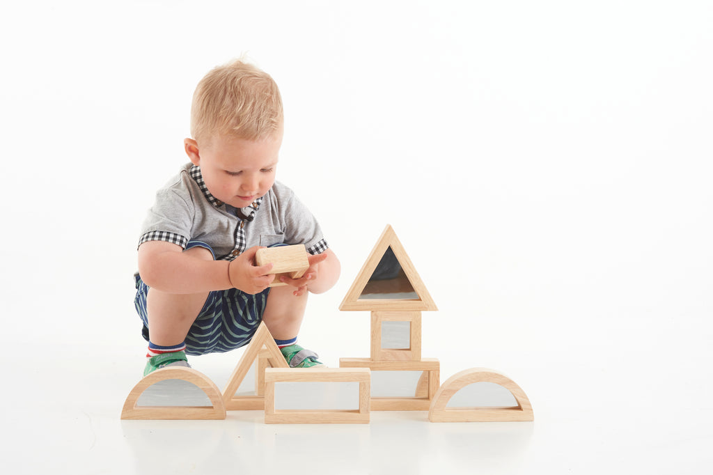 Wooden mirror blocks with triangular top and arched base panels, assembled