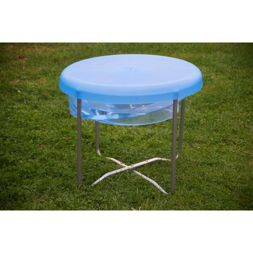 Round clear activity tray on three-leg metal stand with blue cover