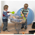 Large round clear activity tray on silver metal stand, open top