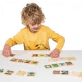 Life cycles jigsaw puzzle with colorful pieces spread on table, child assembling