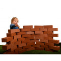 Life-size construction brick set, 50-piece: stack of large brown building blocks with child