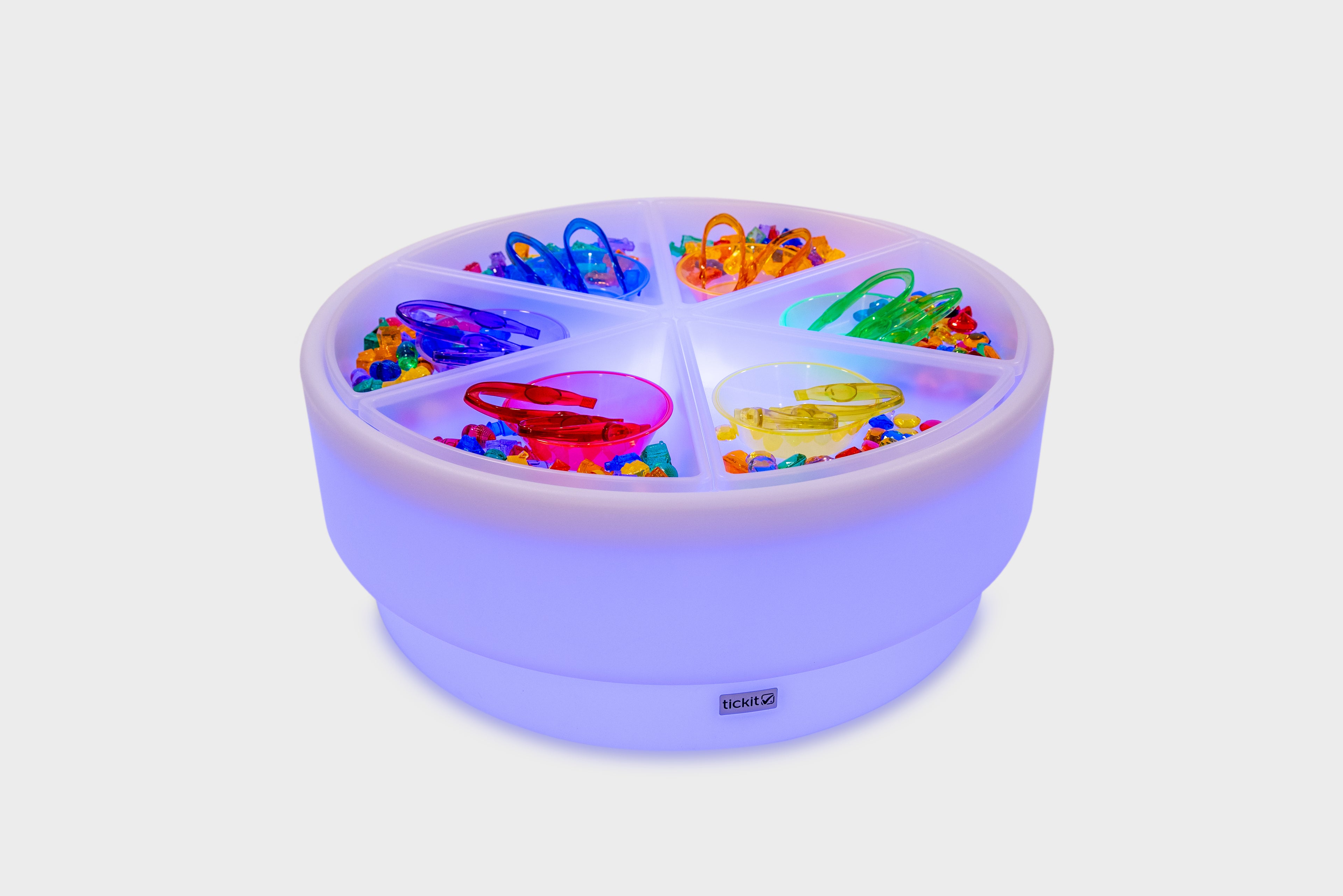 Round sorting table with clear lid and multiple compartment bins with colorful pieces