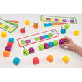Magnetic color sequencing bug board with multicolor ladybug pieces and tracks