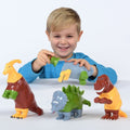 Magnetic dinosaur set with colorful plastic figures in brown, green, and orange