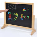 Wooden magnetic activity board with black writing surface, math scribbles and colorful shape pieces