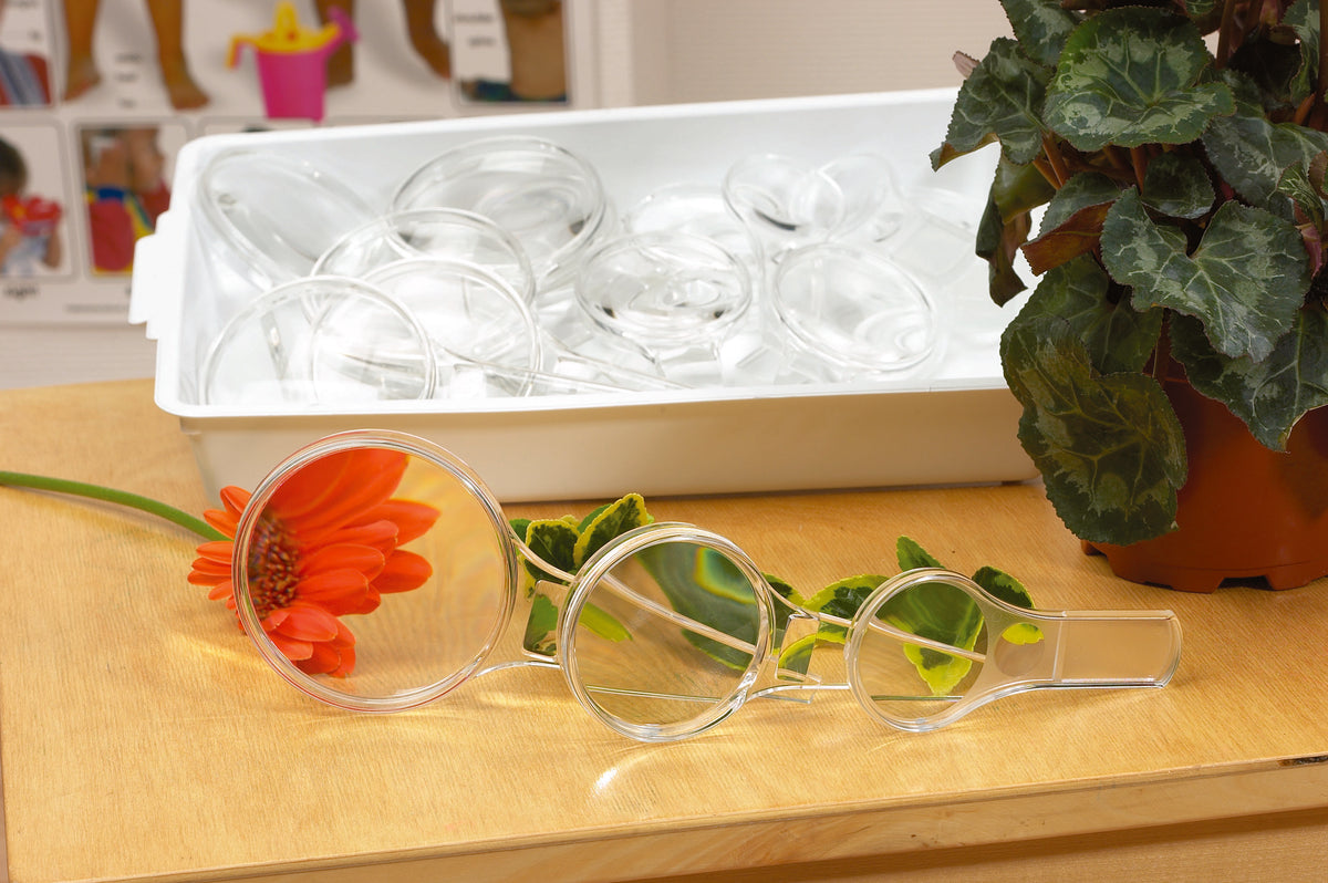 Magnifier set with three round lenses and clear plastic handles