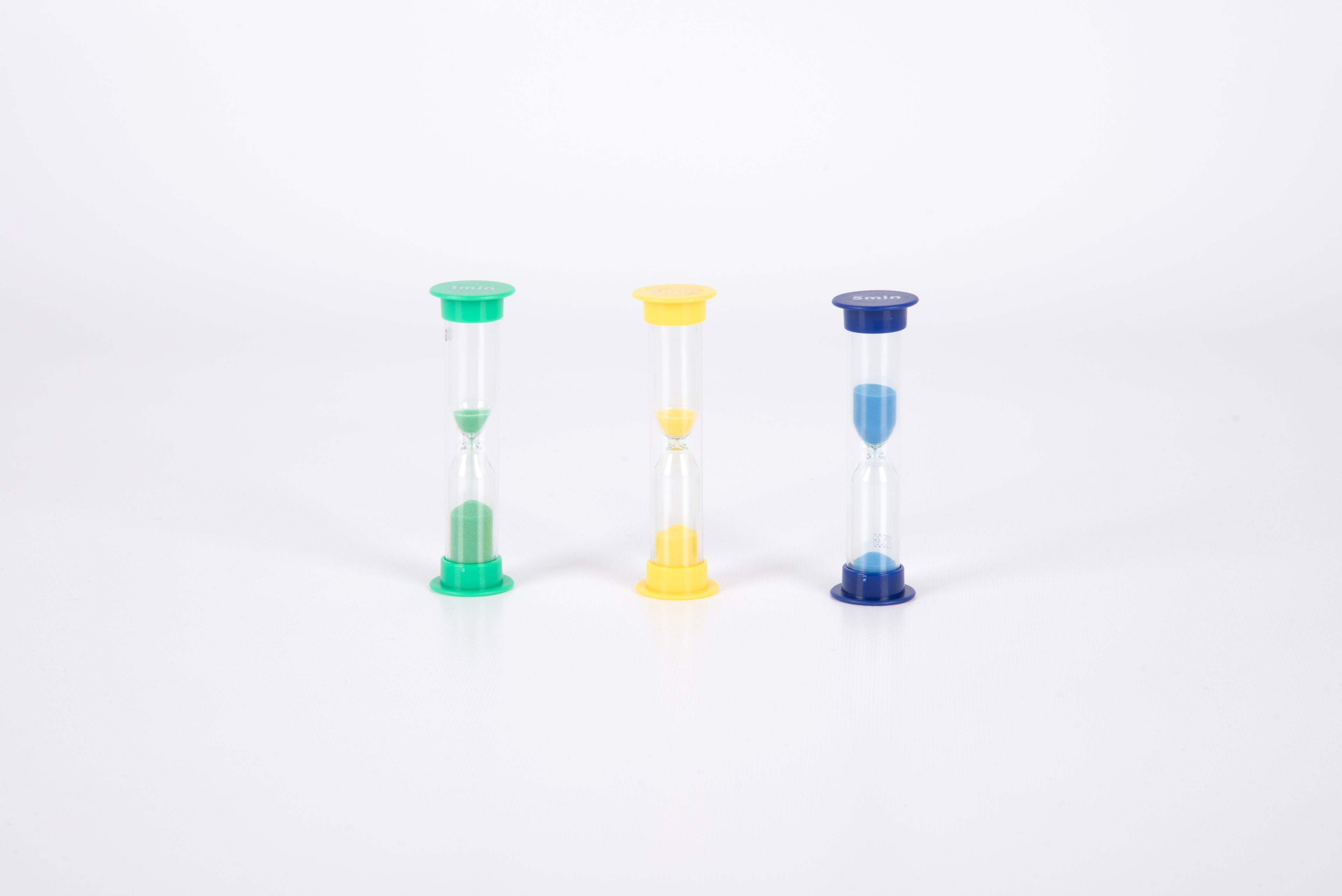 Three mini sand timers side by side: green, yellow, and blue hourglasses