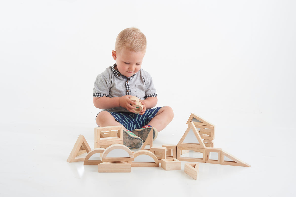 Wooden blocks set with house-shaped pieces and curved wooden arch elements
