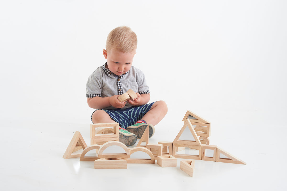 Wooden building block toy with house panels and curved arch pieces